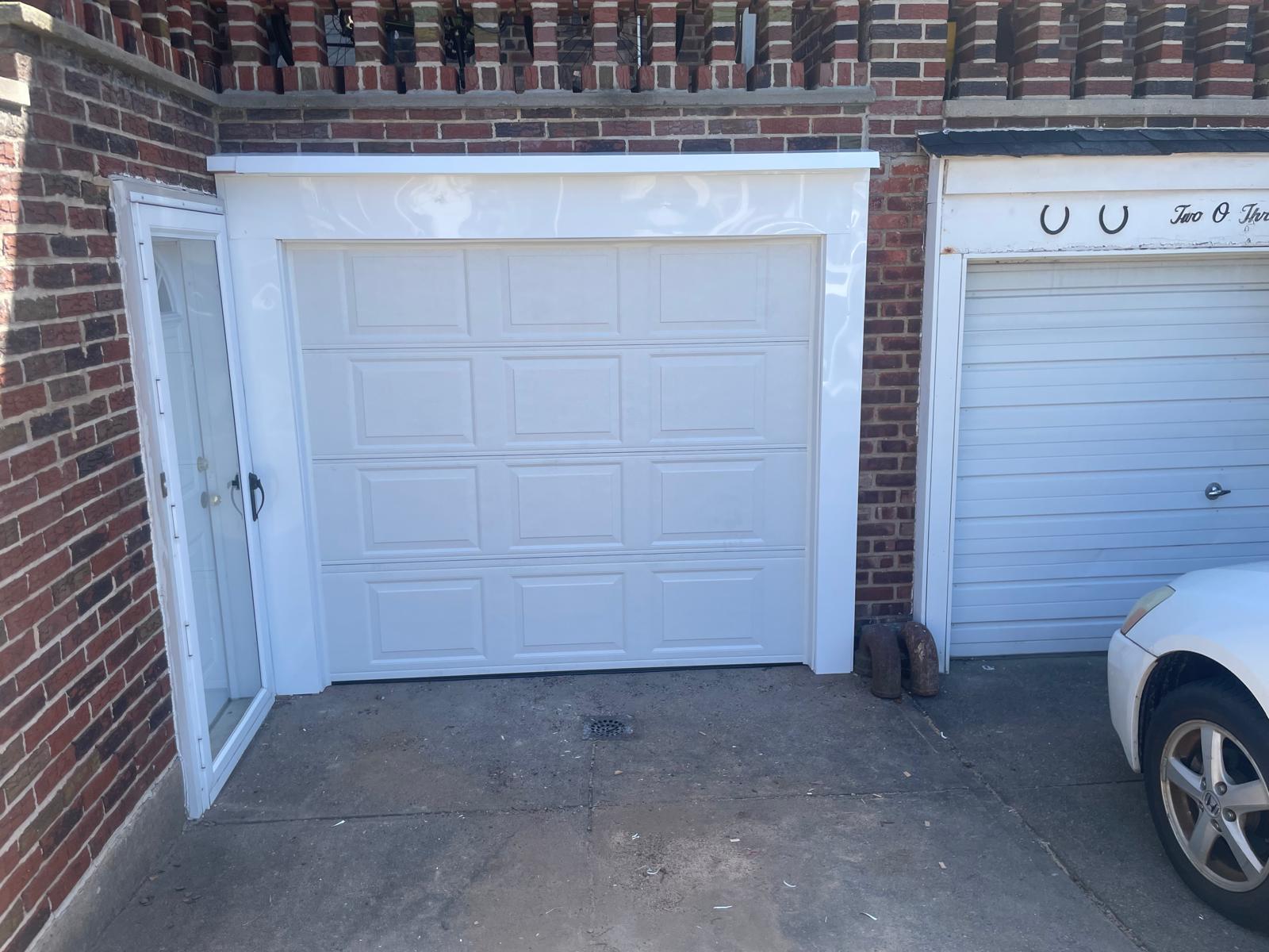 Classic white raised panel garage door installation