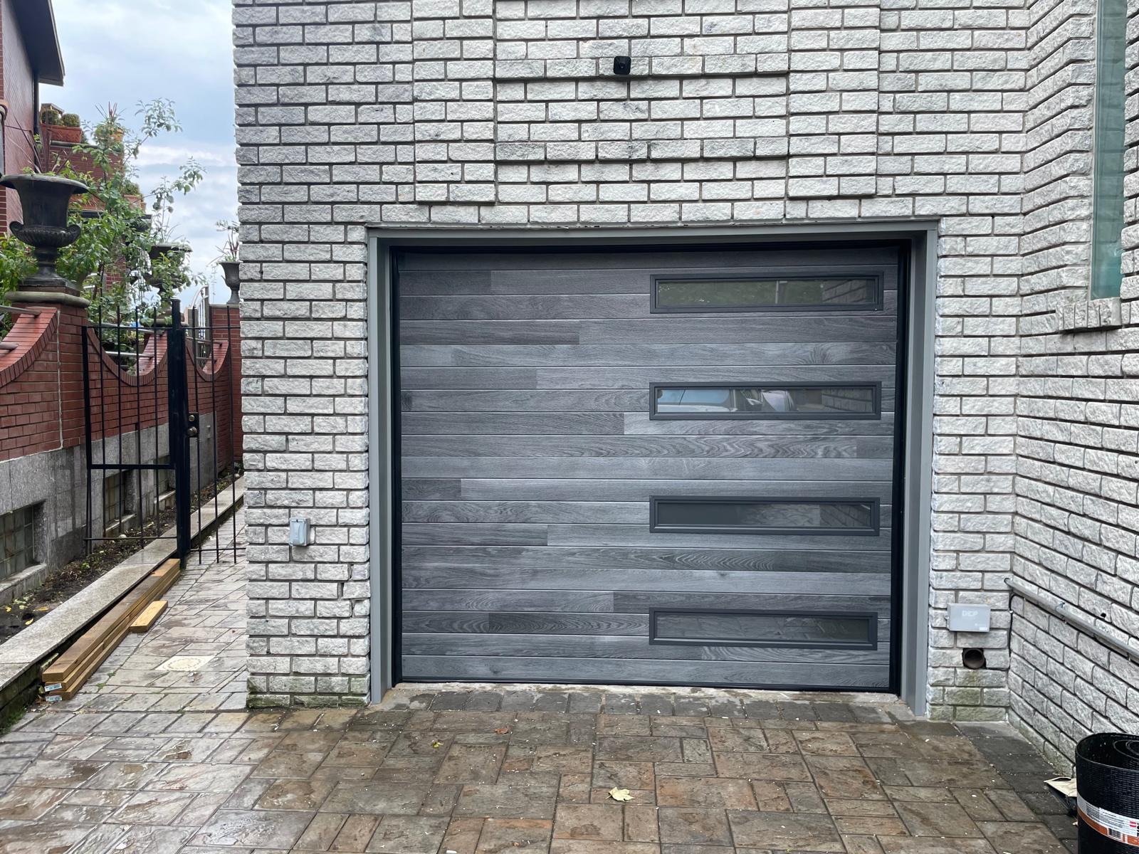Modern gray woodgrain garage door installed by Professional Garage Door NY